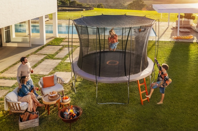 A family gathered around a Vuly Ultra 2 trampoline